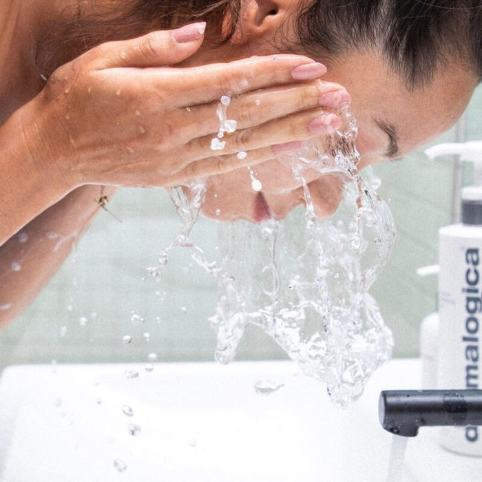 woman washing face